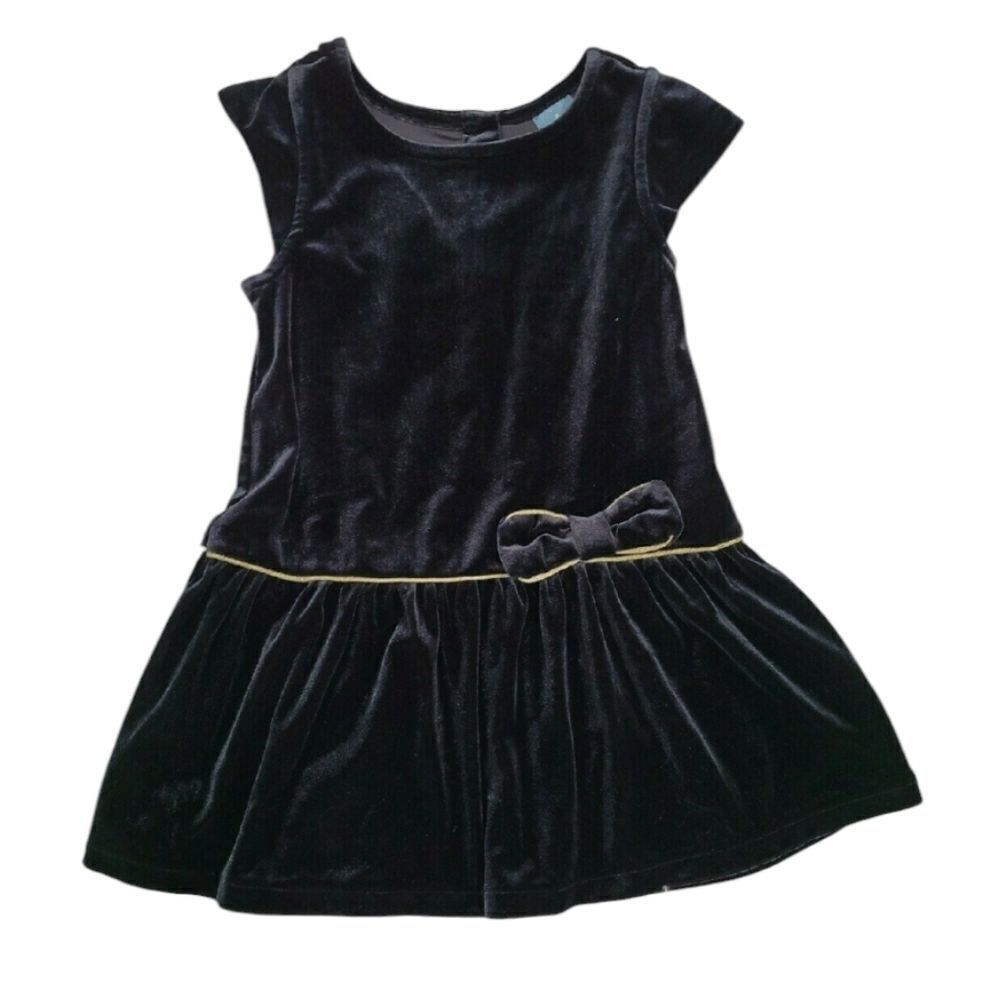 Black velvet dress trimmed in gold piping